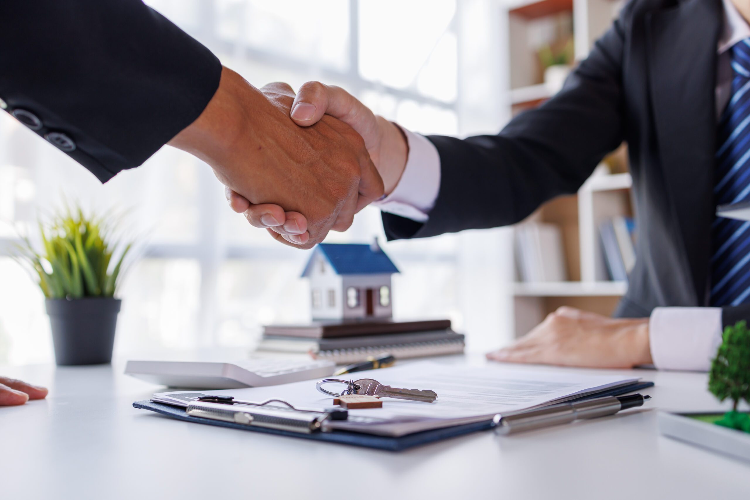 Handshake Real estate brokerage agent Deliver a sample of a mode